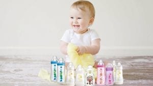 baby with baby bottles